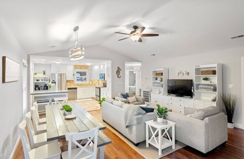 Colington Harbour House | Waterfront! Hot Tub, Game Room, Kayaks, SUPs, Theater Room, Fire Pit, Dogs OK!