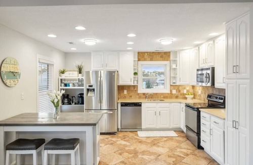Colington Harbour House | Waterfront! Hot Tub, Game Room, Kayaks, SUPs, Theater Room, Fire Pit, Dogs OK!