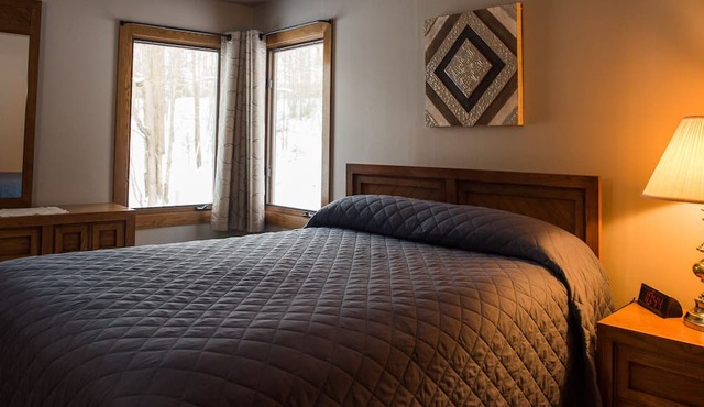 Escape to the Northwoods at this picturesque Sand Lake home in Eagle River
